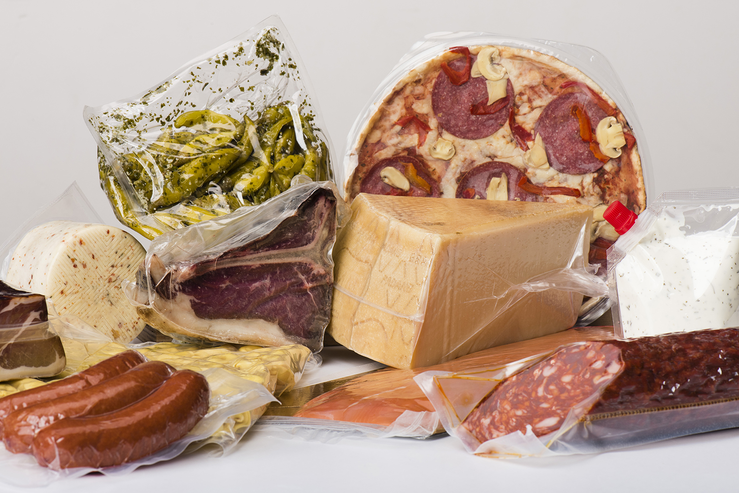 Nylon containing flexible packaging of cheese, meat, fish, and sauces
